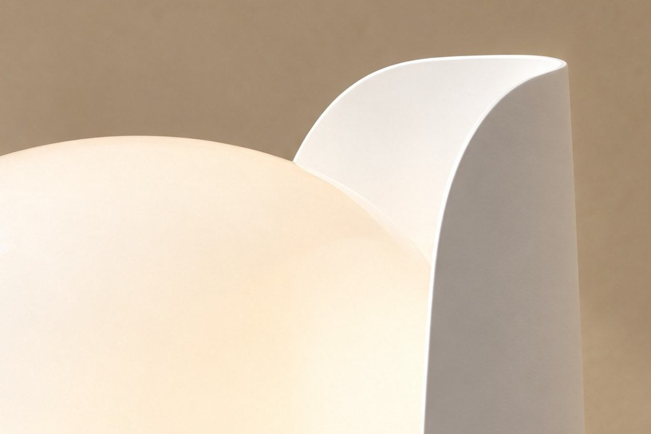 Close-up of the Pethella opal acrylic diffuser meeting its white metal blade