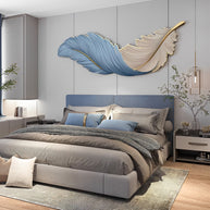 Feather Art Deco LED Wall Lamp in blue, horizontal, mounted above a bed
