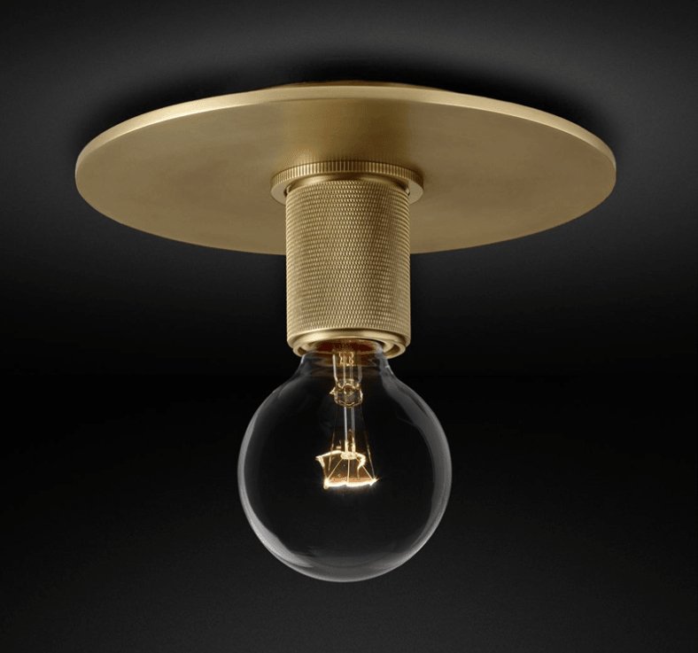 Flush-mount ceiling light with a brass ceiling plate and knurled holder, shown with the bulb exposed.