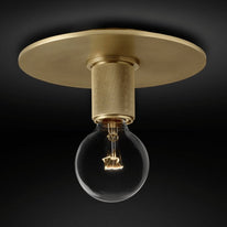 Flush-mount ceiling light with a brass ceiling plate and knurled holder, shown with the bulb exposed.