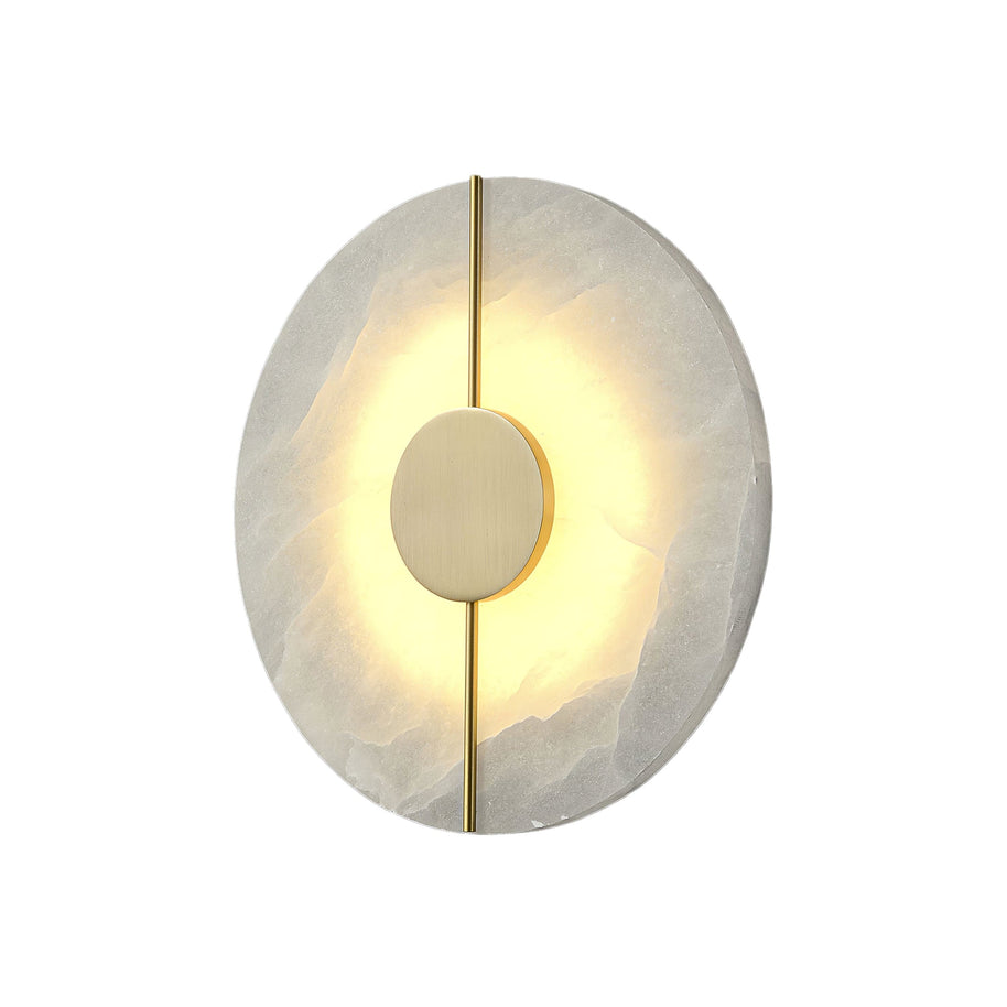 Wall light with a round veined alabaster disc, a slim brass rod and a brass centre disc lit on a white background.