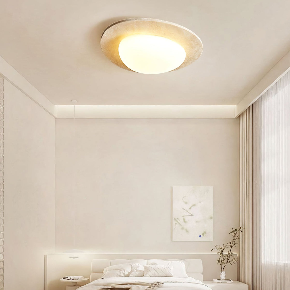 Avessan Ceiling Light lit above a white bedroom with abstract art