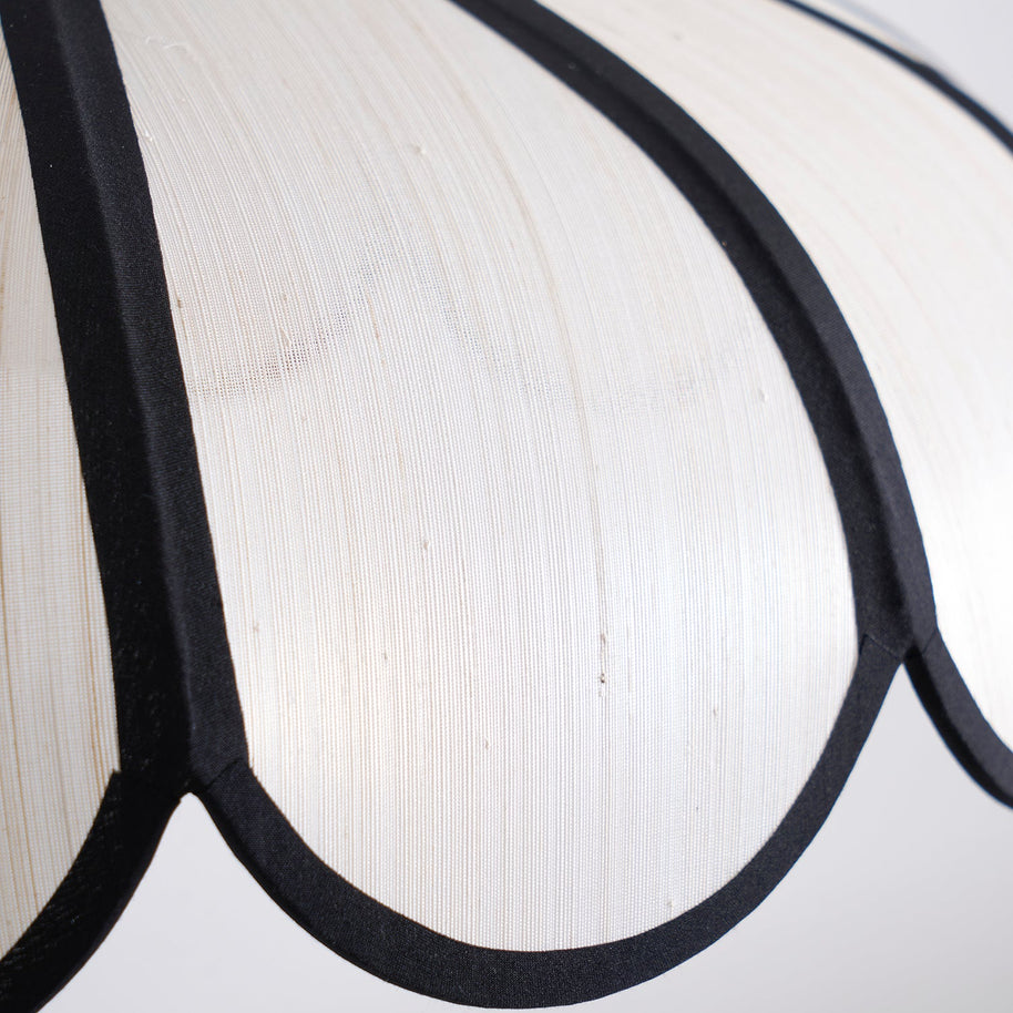 Close view of the shade surface showing its woven texture and a dark rib.
