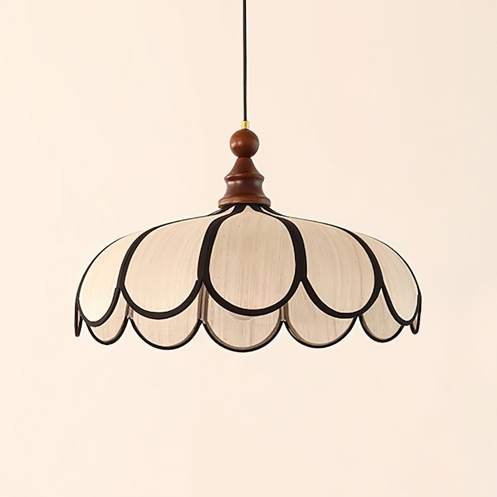 Pendant light with a scalloped beige shade, dark ribs and a turned walnut-coloured wooden top, shown large on a plain background.