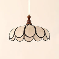 Pendant light with a scalloped beige shade, dark ribs and a turned walnut-coloured wooden top, shown large on a plain background.