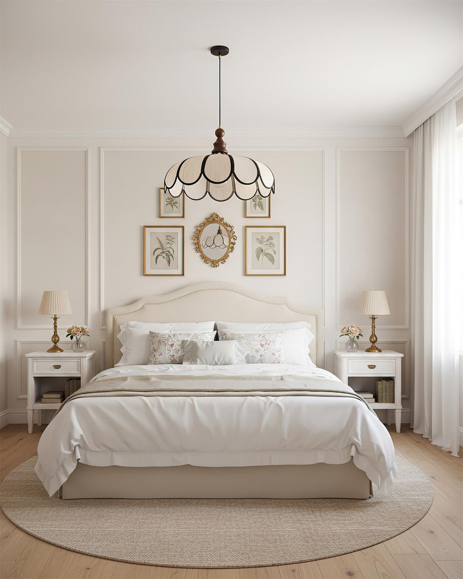Pendant light with a scalloped beige shade, dark ribs and a turned walnut-coloured wooden top above a bed in a panelled bedroom.