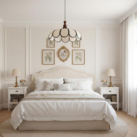 Pendant light with a scalloped beige shade, dark ribs and a turned walnut-coloured wooden top above a bed in a panelled bedroom.