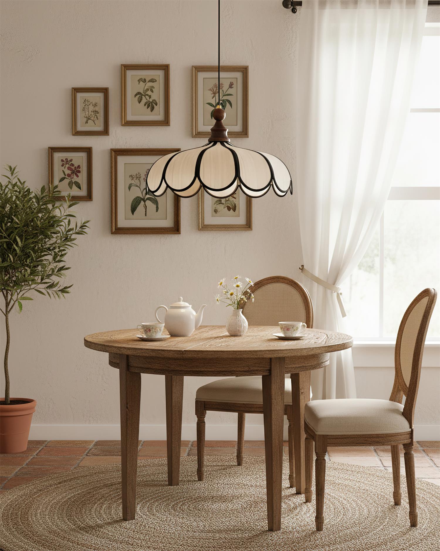 Pendant light with a scalloped beige shade, dark ribs and a turned walnut-coloured wooden top above a round table below framed botanical prints.