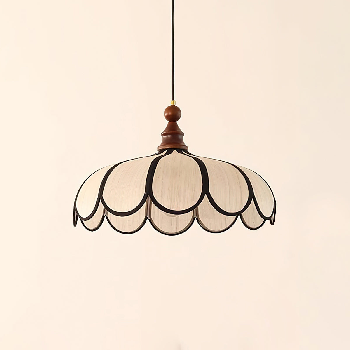 Pendant light with a scalloped beige shade, dark ribs and a turned walnut-coloured wooden top, shown on a plain background.