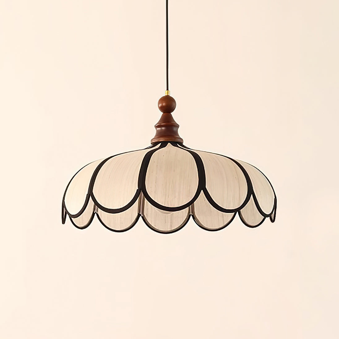 Pendant light with a scalloped beige shade, dark ribs and a turned walnut-coloured wooden top, shown on a plain background.
