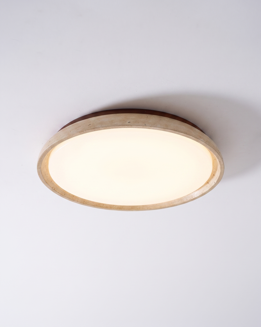 Pietra Walnut Travertine Ceiling Light in walnut colour and beige, shown lit with warm white light.
