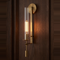 Valenne Ribbed Glass Wall Sconce lit against dark walnut panelling