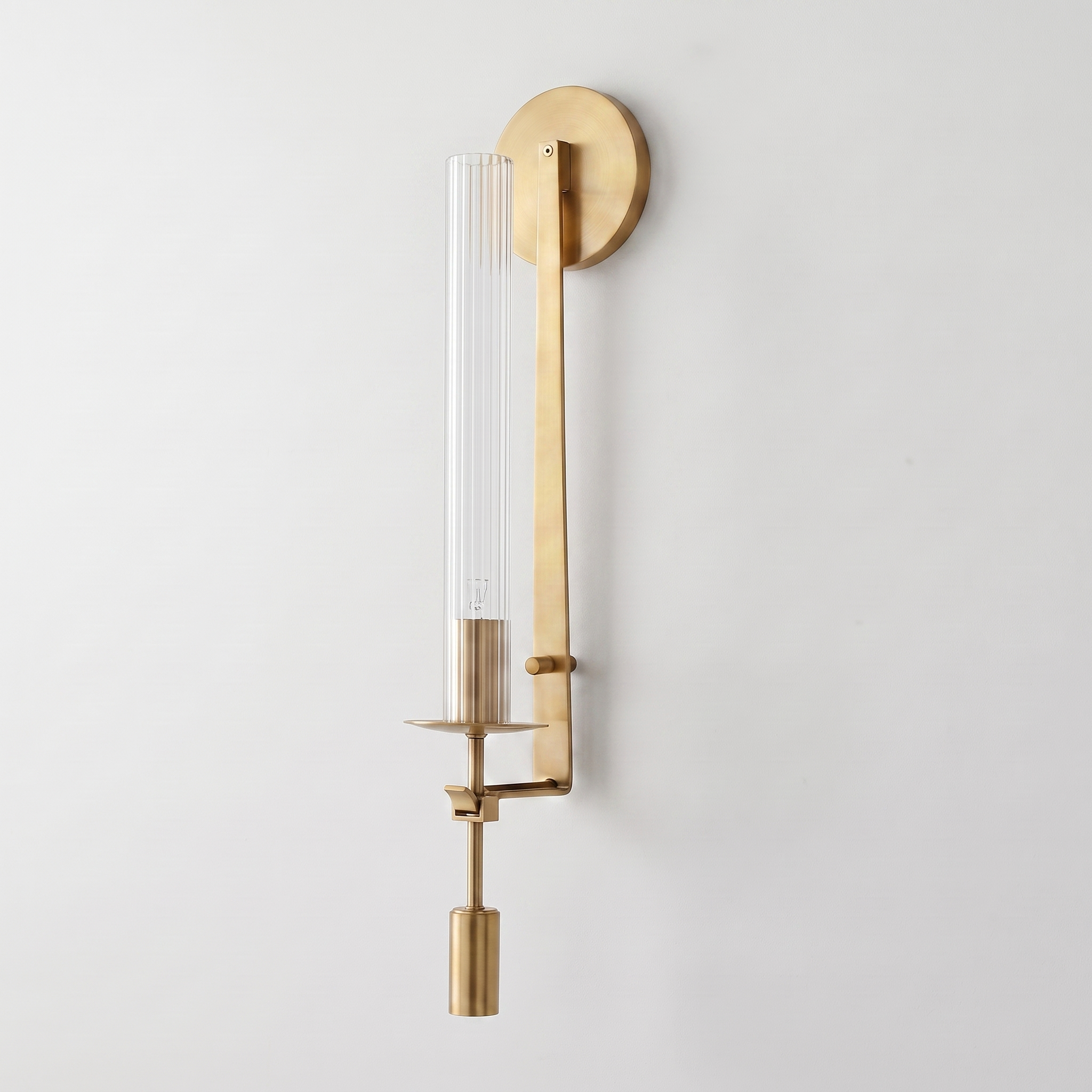 Valenne Ribbed Glass Wall Sconce in brass and clear ribbed glass, complete, on a plain studio background.