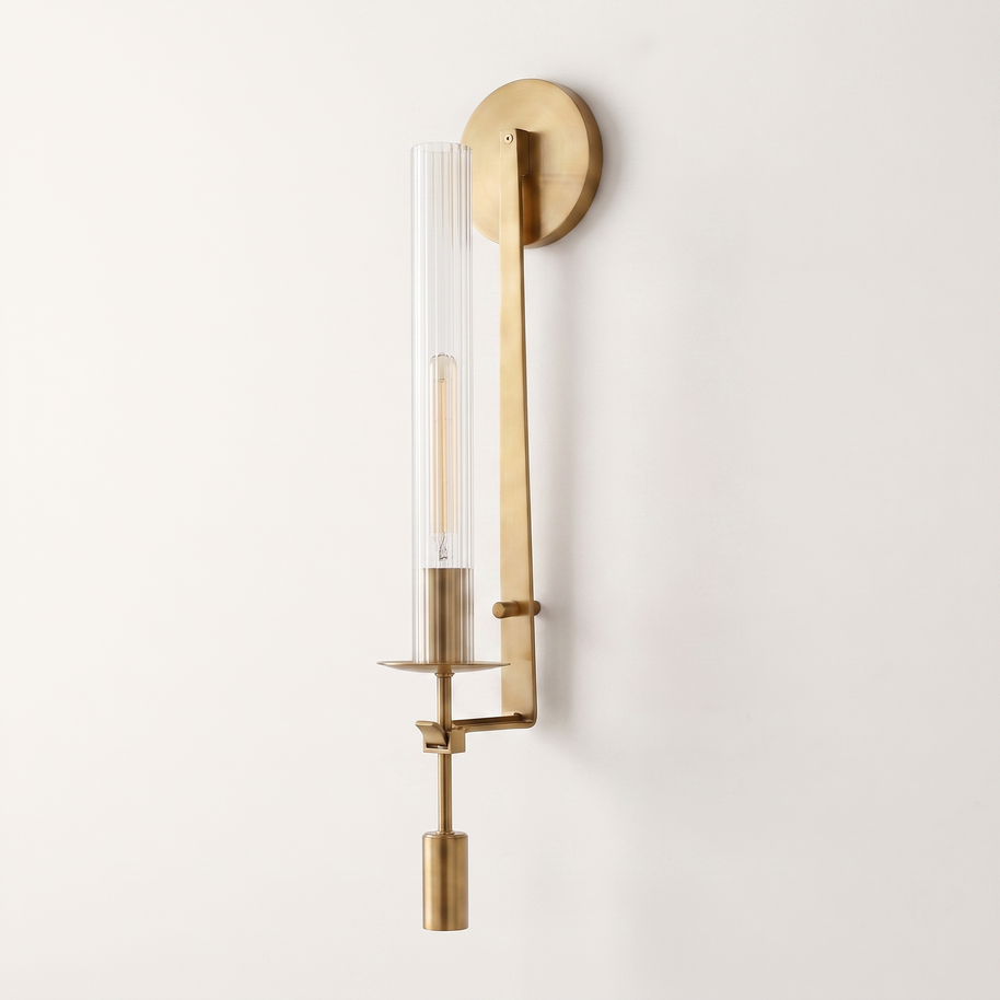 Valenne Ribbed Glass Wall Sconce, three-quarter studio view of the brass arm and ribbed glass cylinder