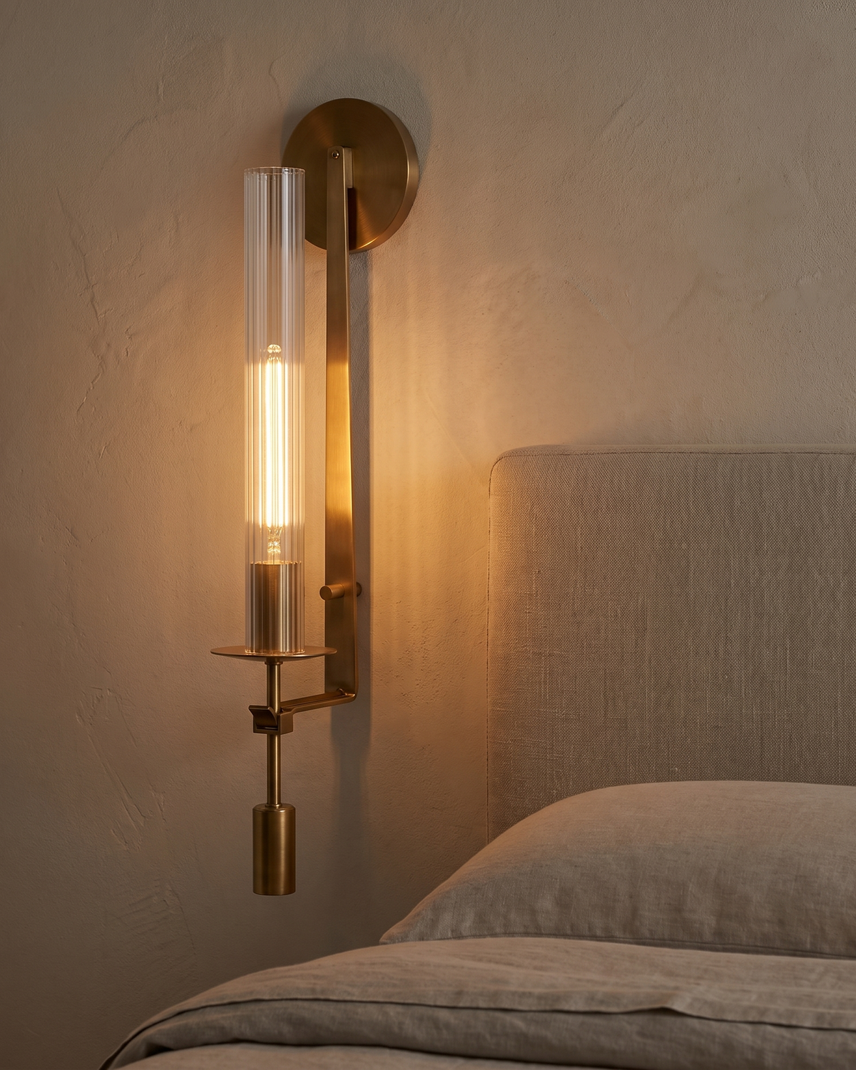 Valenne Ribbed Glass Wall Sconce in a styled room