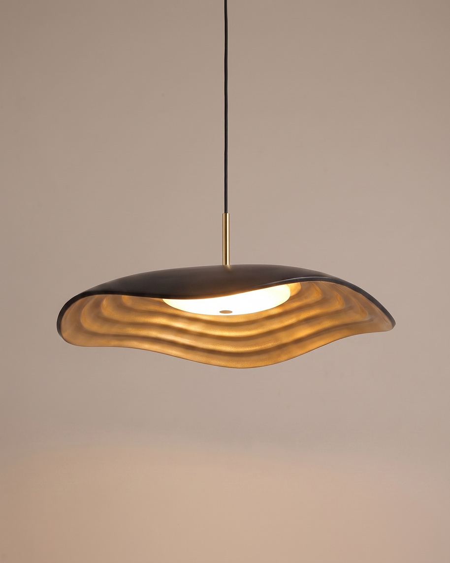 Comvilo Valentina Pendant Lamp in black resin and acrylic, shown lit with warm light.