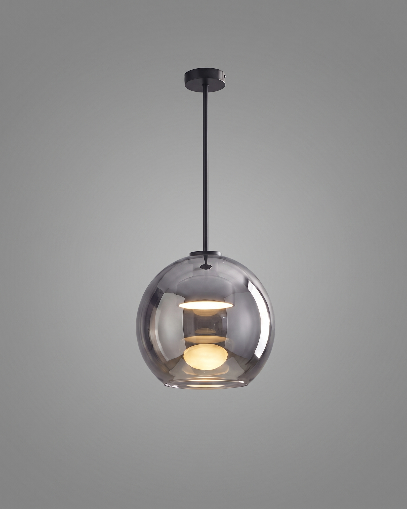 Comvilo Metro Sphere Glass Pendant Lamp in black metal and smoke-grey glass, installed in a plain interior.