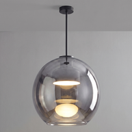 Comvilo Metro Sphere Glass Pendant Lamp in black metal and smoke-grey glass, shown lit with warm light.