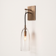 Comvilo Lure Wall Lamp in brass and clear, at a three-quarter studio angle.