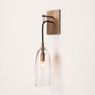 Comvilo Lure Wall Lamp in brass and clear, showing construction and wall mounting.