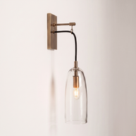 Comvilo Lure Wall Lamp in brass and clear, in profile from an alternate angle.
