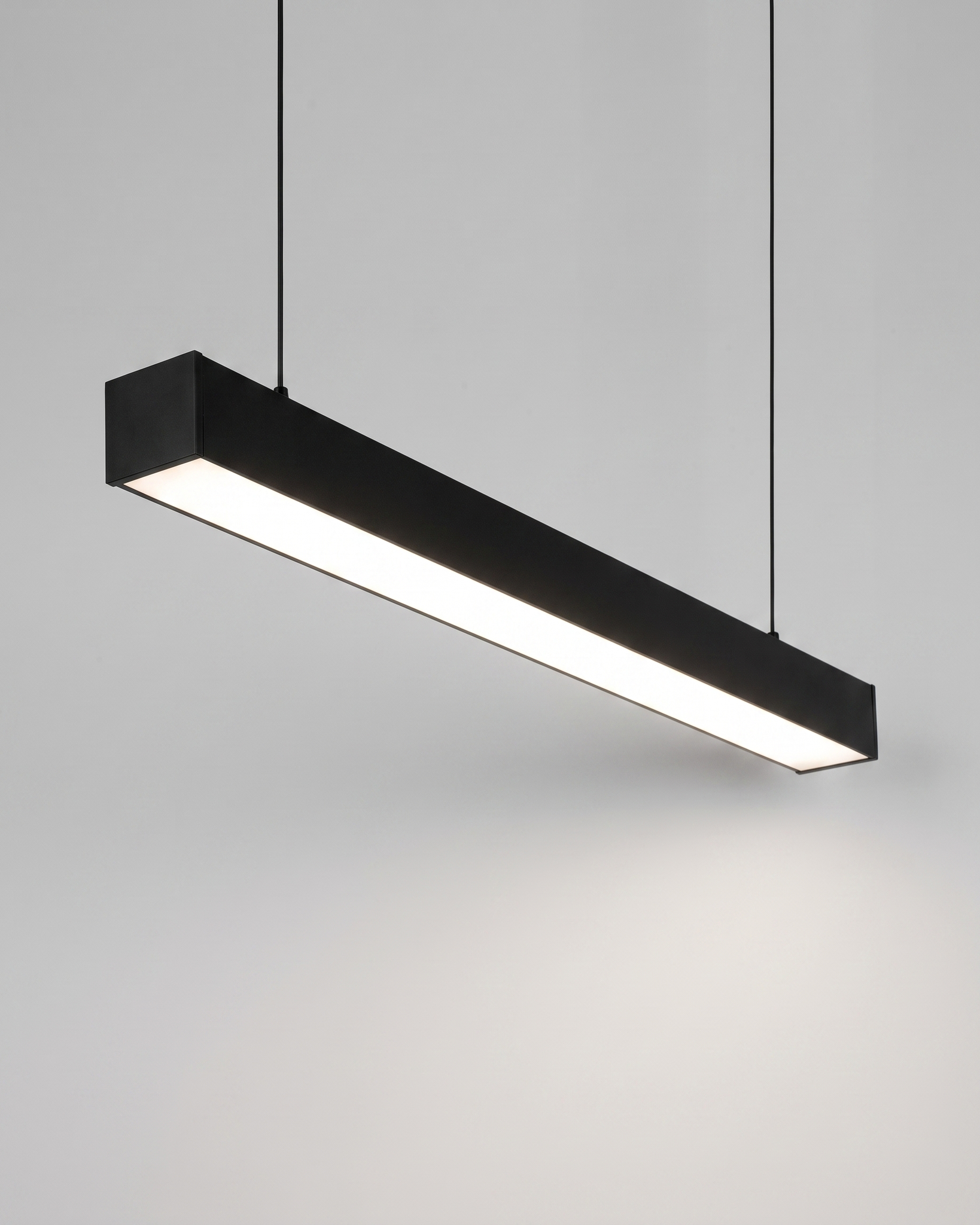 Comvilo Minimalist Black LED Recessed Office Hanging Linear Light Set in black, shown lit with neutral white light.