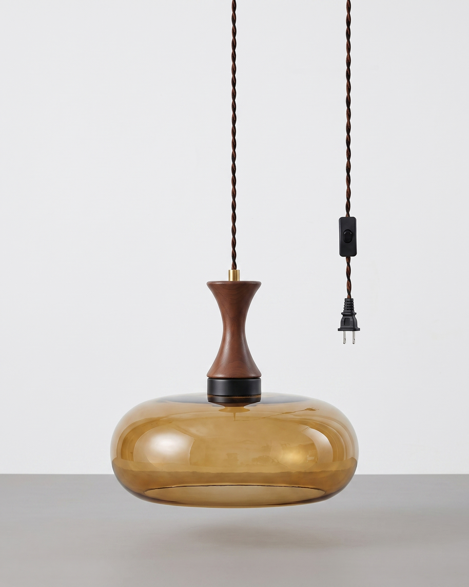 Orlena Antique Brown Glass Plug-In Pendant in antique brown glass, installed in a plain interior.