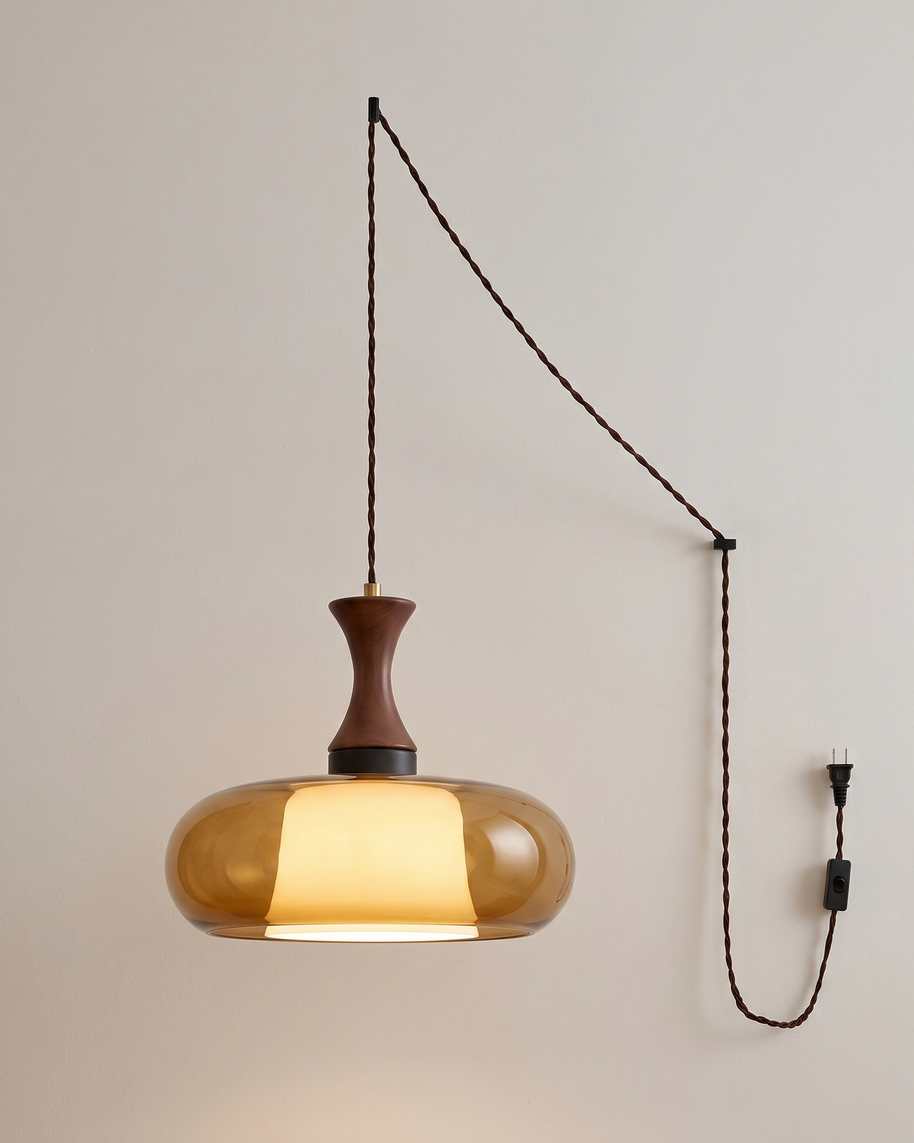 Orlena Antique Brown Glass Plug-In Pendant in antique brown glass, shown lit.