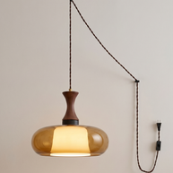 Orlena Antique Brown Glass Plug-In Pendant in antique brown glass, shown lit.
