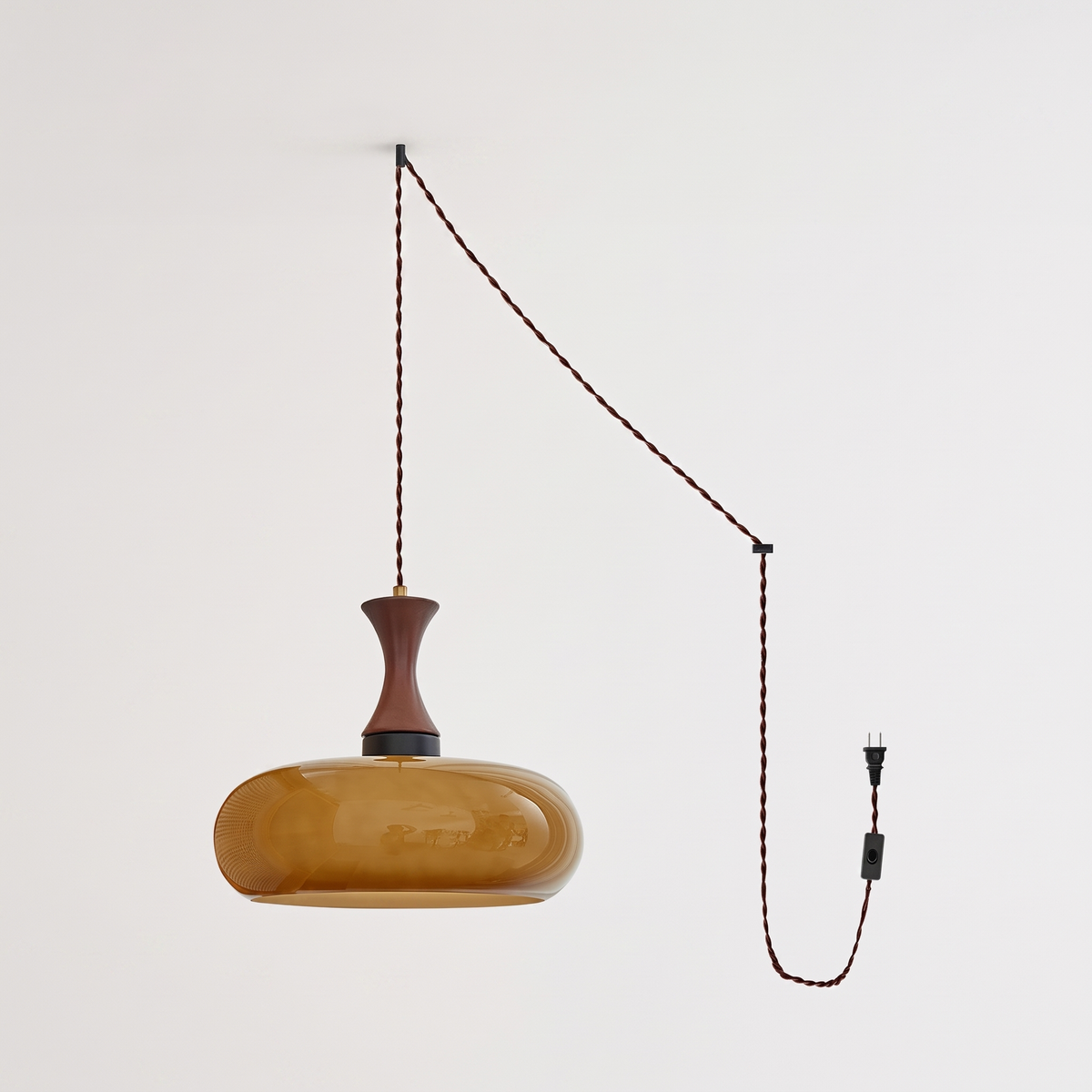 Orlena Antique Brown Glass Plug-In Pendant in antique brown glass, complete, on a plain studio background