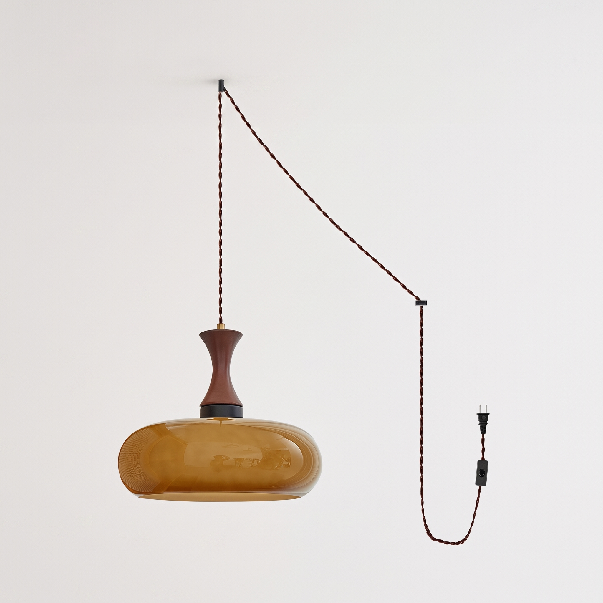 Orlena Antique Brown Glass Plug-In Pendant in antique brown glass, complete, on a plain studio background.