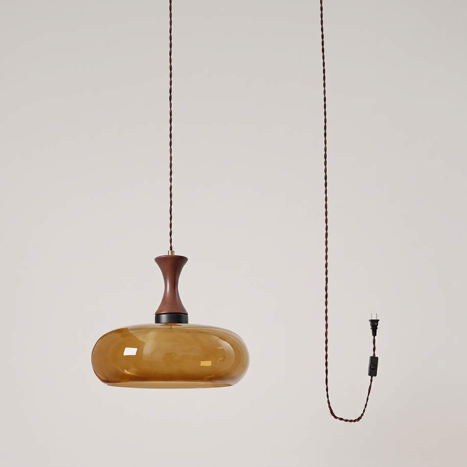 Orlena Antique Brown Glass Plug-In Pendant in antique brown glass, at a three-quarter studio angle.