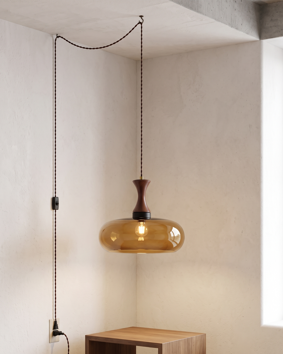 Orlena Antique Brown Glass Plug-In Pendant in a styled room
