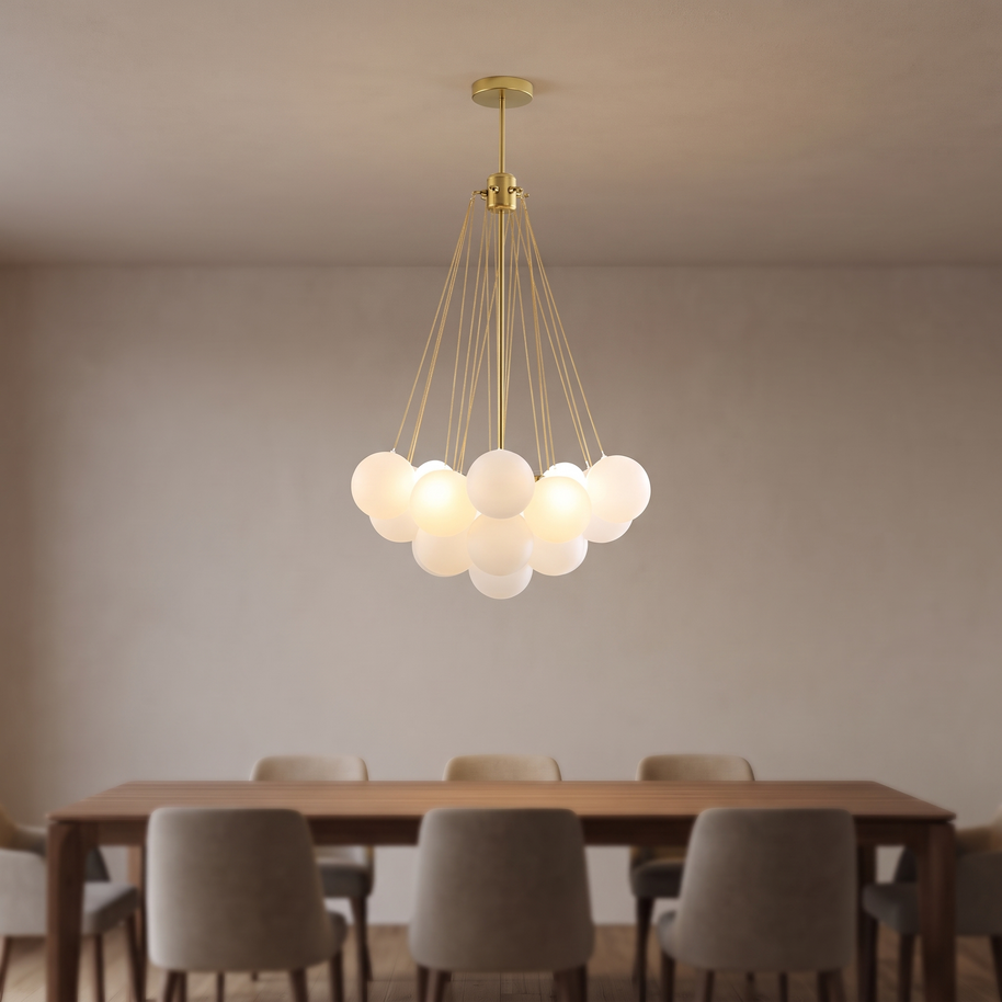 Gold chandelier with clustered white glass globes above a dining table.