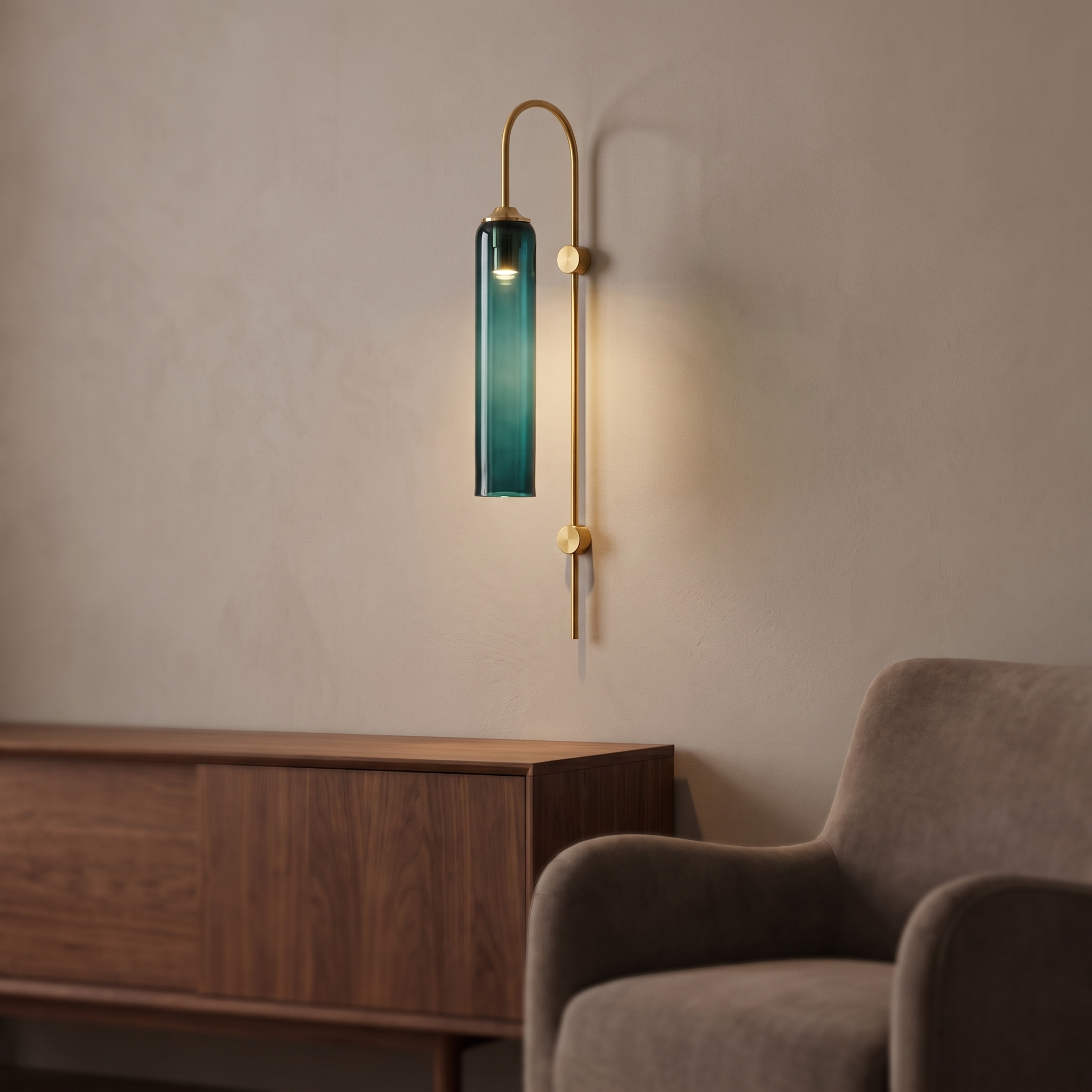 Gold wall light with a long green glass shade.