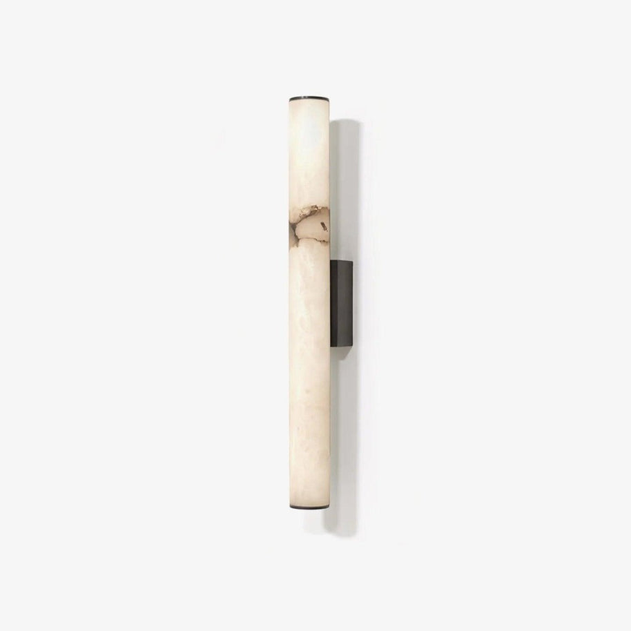 Wall lamp with a long pale veined stone-look tube and a dark bracket, unlit, on a white background.