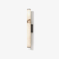 Wall lamp with a long pale veined stone-look tube and a dark bracket, unlit, on a white background.