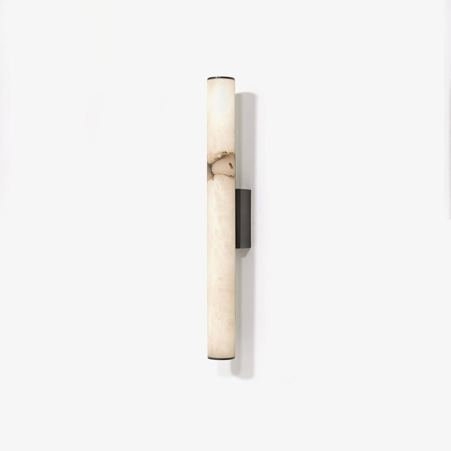 Wall lamp with a long pale veined stone-look tube and a dark bracket, unlit, on a white background, seen straight on.