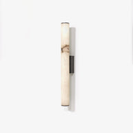 Wall lamp with a long pale veined stone-look tube and a dark bracket, unlit, on a white background, seen straight on.
