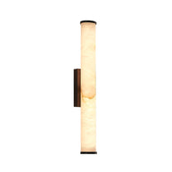 Wall lamp with a long pale veined alabaster tube and a black bracket lit, shown whole on a white background.