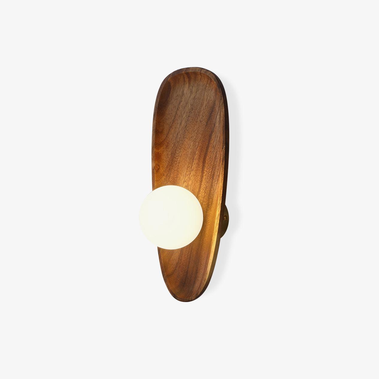 Wall lamp with a shaped wooden backplate and a white glass globe set low on the plate, shown unlit on a plain background.
