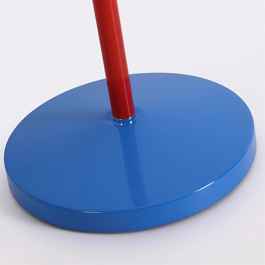 Close view of the round blue base and the foot of the red stem.
