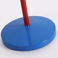 Close view of the round blue base and the foot of the red stem.