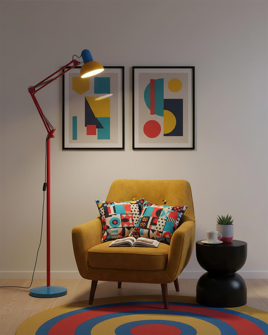 Adjustable floor lamp with a red arm, yellow shade and round blue base beside a mustard armchair on a round striped rug.