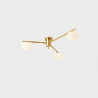 Jasper Ceiling Lamp, three-head brass and white fixture on a plain background