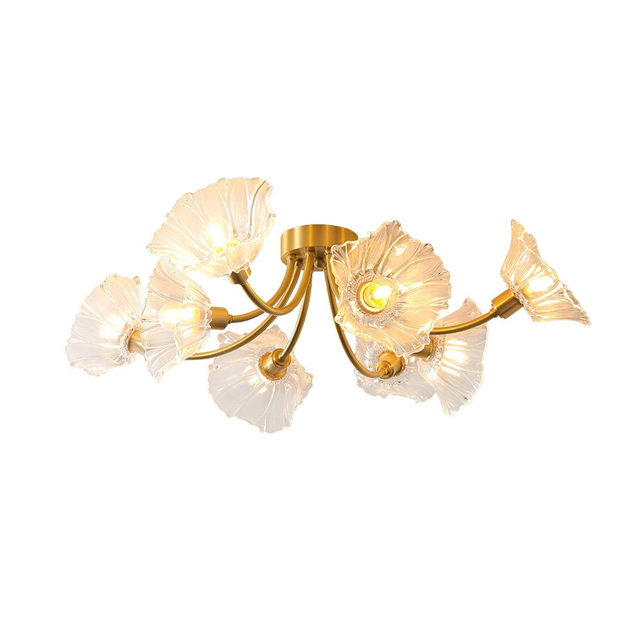 Flush-mount ceiling lamp with curved brass arms holding clear ribbed flower-shaped glass shades, lit, on a white background.