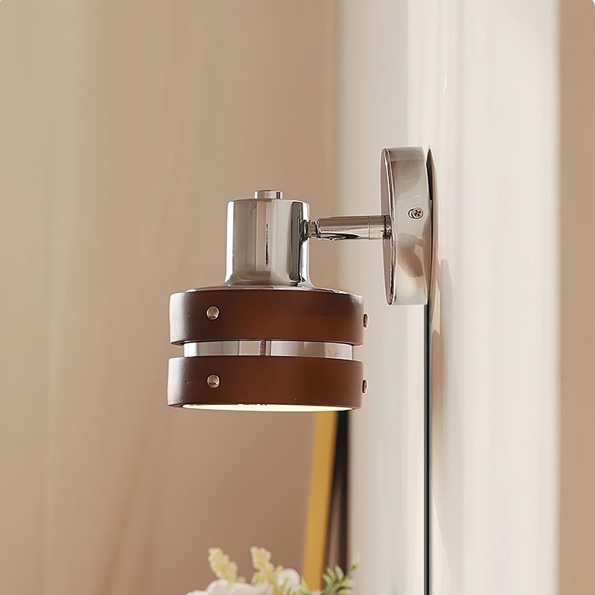 Karrivelle Wall Light, side view on a beige wall
