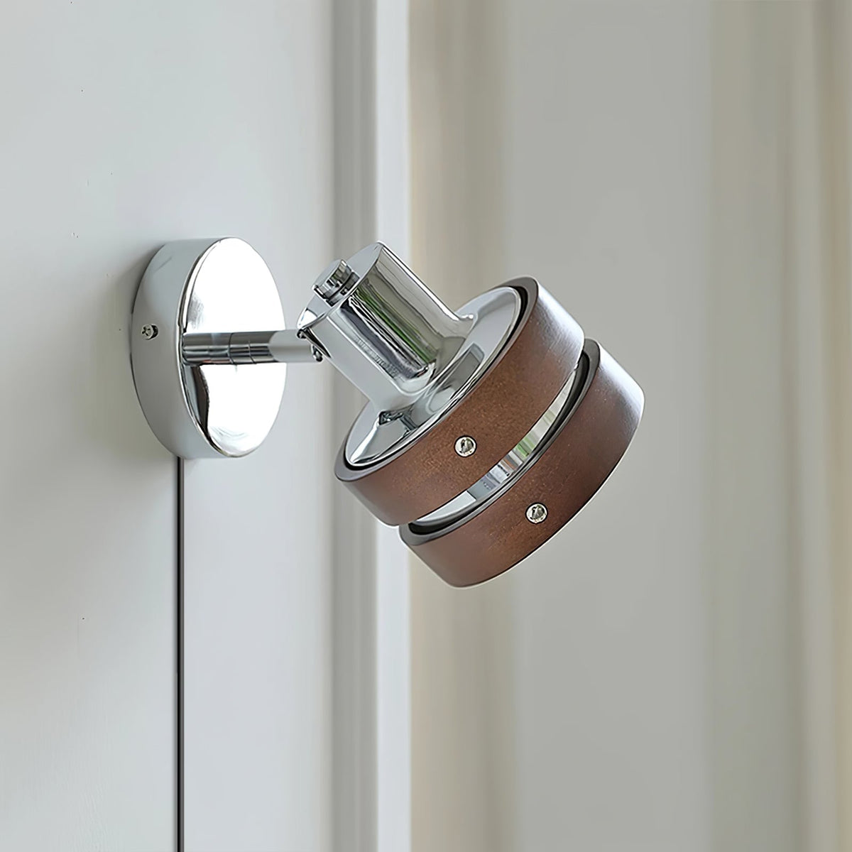 Karrivelle Wall Light, side detail of chrome swivel and wood bands