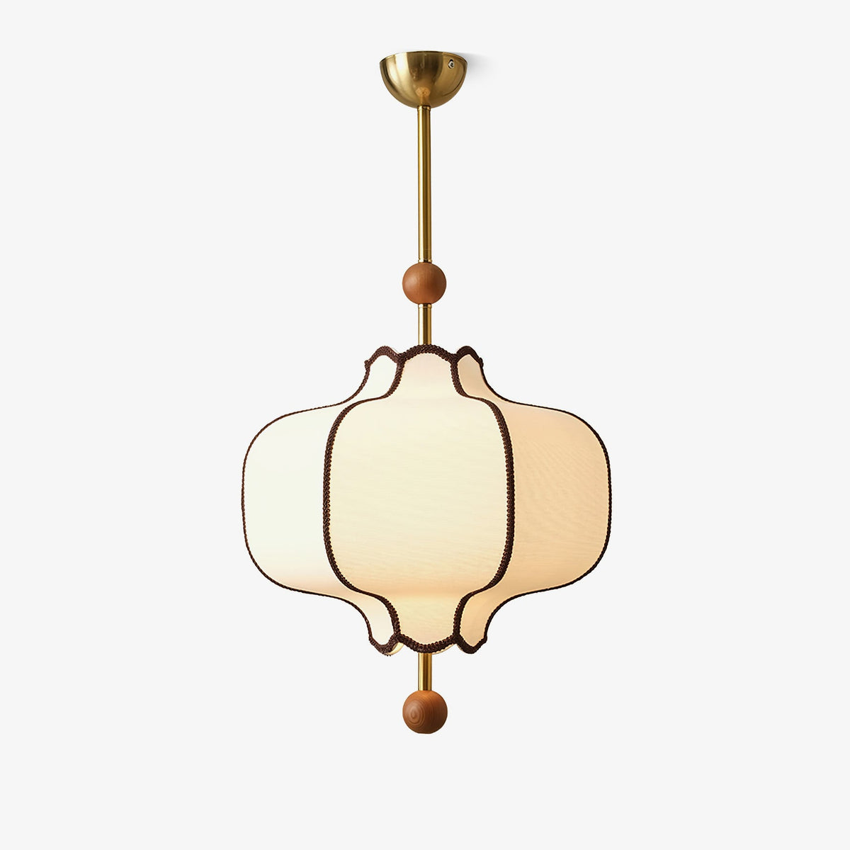 Lit white fabric lantern pendant on a brass rod with a domed canopy, on a plain white ground.