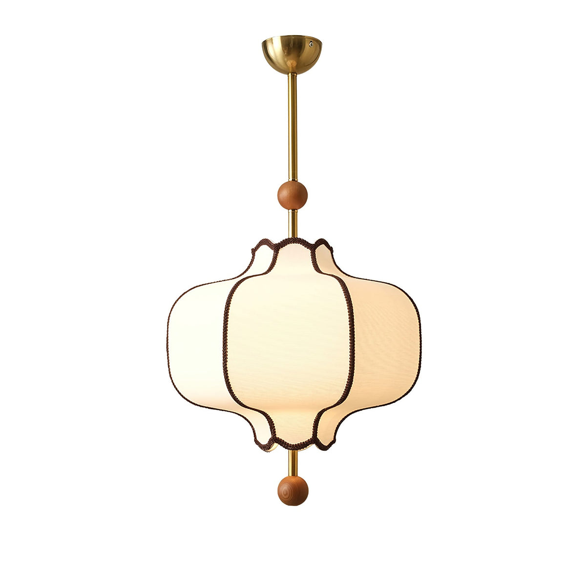 Lit white fabric lantern pendant with brown braid trim, brass rod and wooden beads, on white.